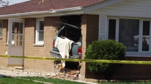 A man was killed when the SUV he was driving crashed into a home in the 12800 block of South Muskegon Wednesday afternoon in the Hegewisch neighborhood on the Far South Side, police said. | Devlin Brown/for Sun-Times Media