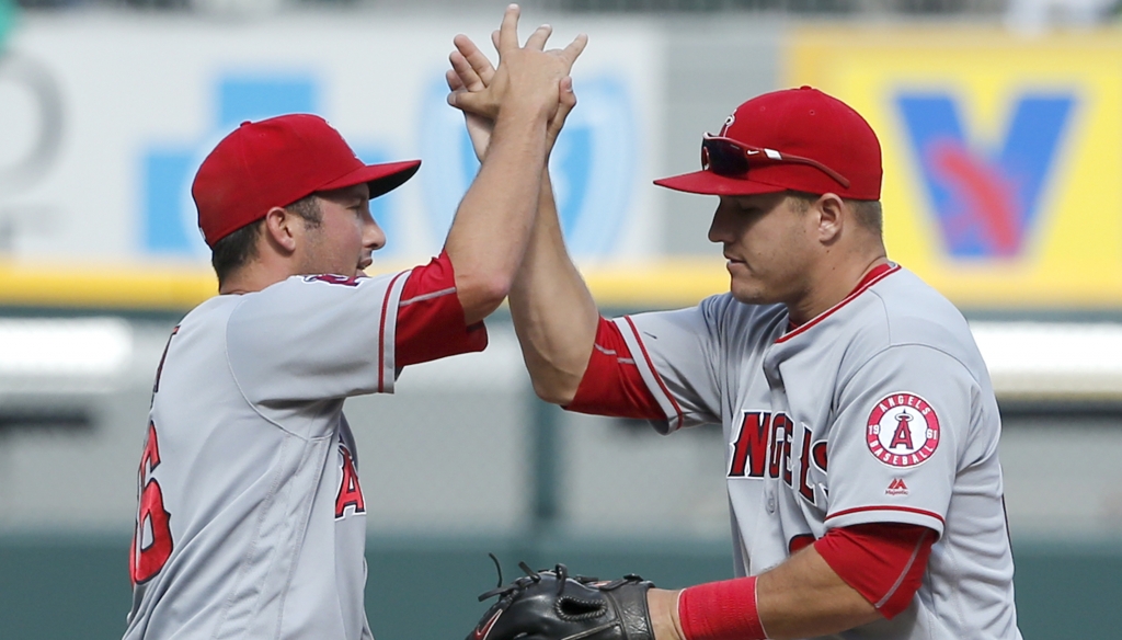 Los Angeles Angels relief pitcher Huston Street, left, celebrates with Mike Trout after a baseball game and the Angels' 3-2 win over the Chicago White Sox, Thursday, April 21, 2016, in Chicago. (AP Photo/Charles Rex Arbogast)