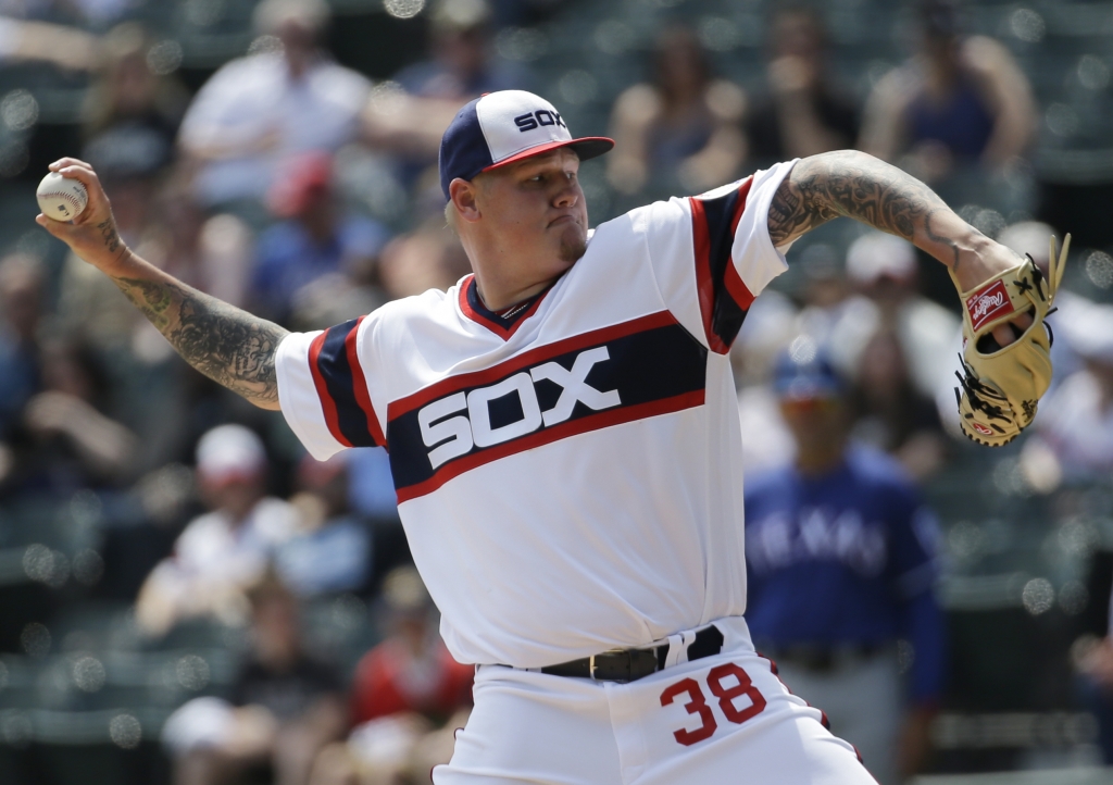 Chicago White Sox starter Mat Latos throws against theTexas Rangers during the first inning of a baseball game Sunday, April 24, 2016, in Chicago. (AP Photo/Nam Y. Huh)