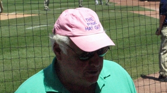 guy in pink hat at wrigley field